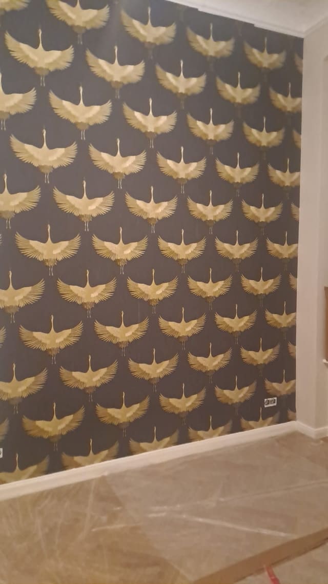 Close-up of gold dragonfly-pattern wallpaper